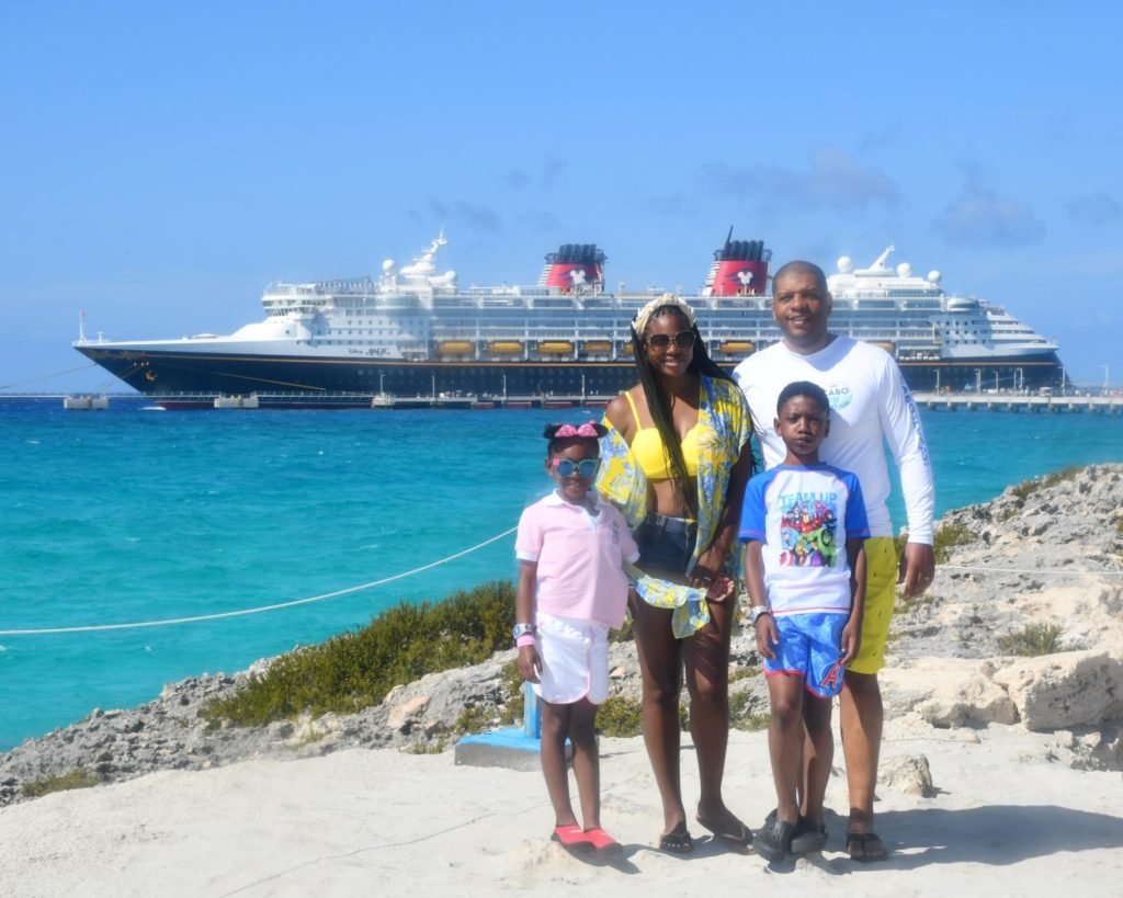 Family photo during a Disney cruise port day, source of insights for planning kids' parties.