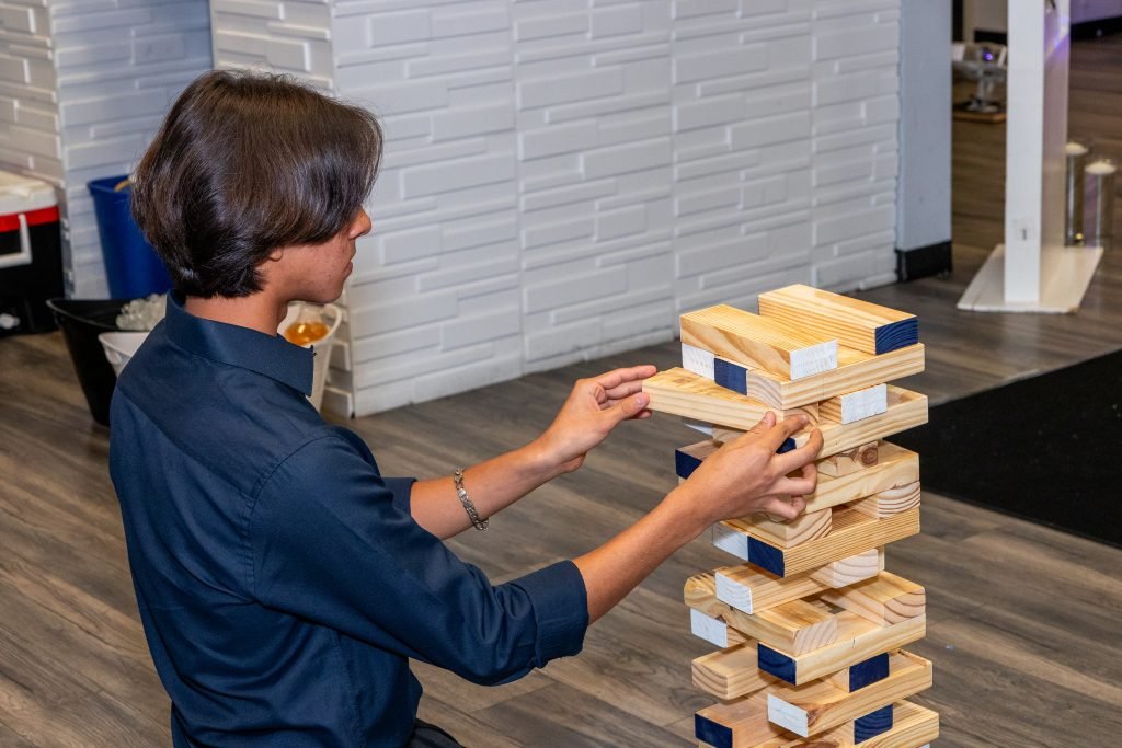 guest playing jenga during quinceanera in georgia