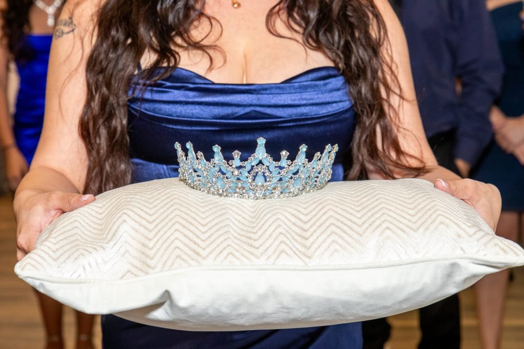 Quinceañera during her crowning ceremony, a meaningful moment in her Atlanta celebration.